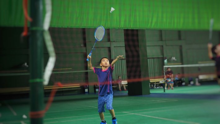 Asian,Boy,Playing,Badminton.(selected,Focus)