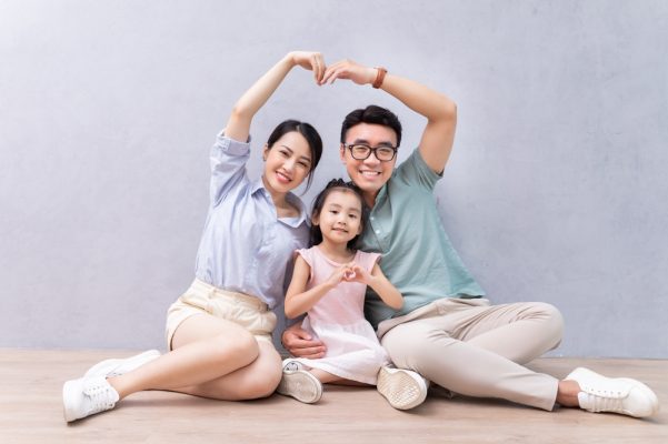 Young,Asian,Family,Sitting,On,The,Floor