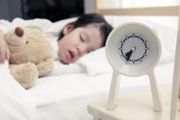 Happy,Asian,Child,Girl,And,Alarm,Clock,Wake,Up,In