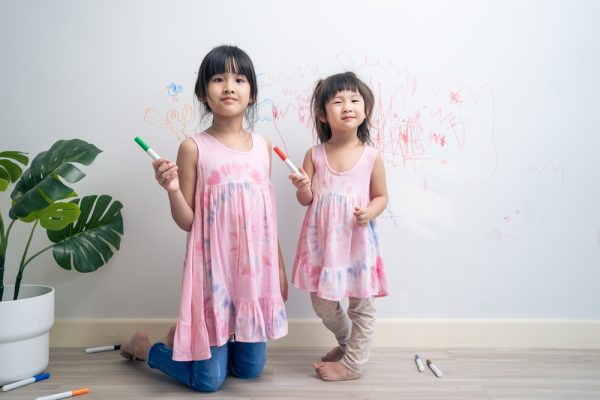 Asian,Young,Sibling,Kid,Girl,Enjoy,Paint,On,White,Wall