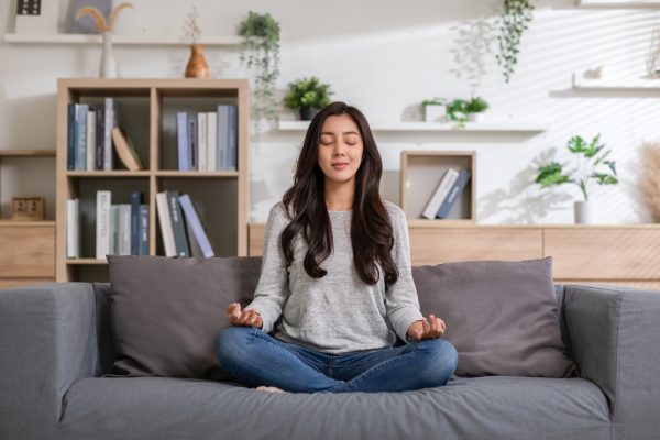 Clam,Of,Asian,Young,Woman,Doing,Yoga,Lotus,Pose,To